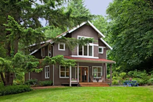 House in lush, green woods has energy efficient windows